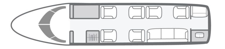 Floor plan of a private jet cabin with seating, a sofa, and a lavatory.