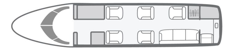 Floor plan of a private jet cabin with seating and a sofa.